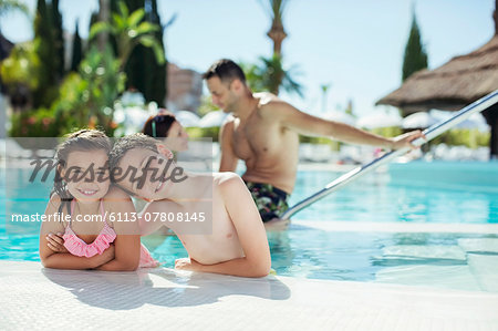 Portrait of smiling boy and girl in swimming pool