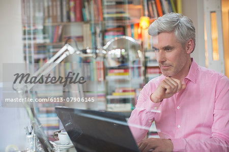 Businessman working on laptop in home office