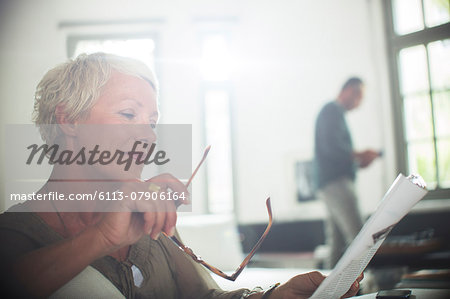 Businesswoman reading paperwork