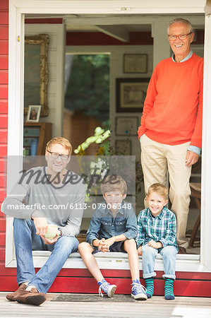 Brothers smiling with father and grandfather Brothers smiling with father and grandfather