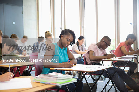 University students taking exam at classroom