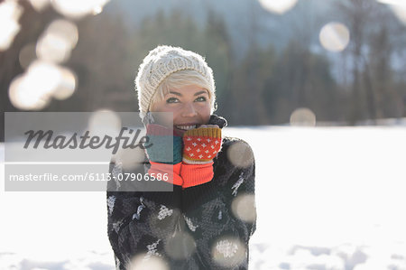 Portrait of smiling woman in snow