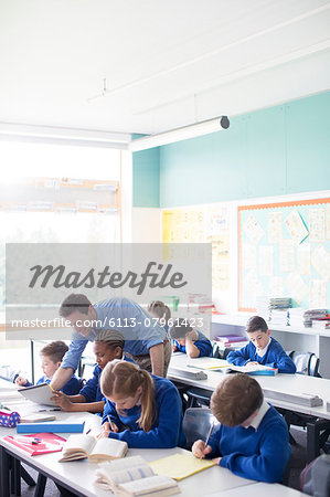 Teacher with his pupils in classroom