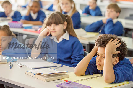 Elementary school children bored in classroom