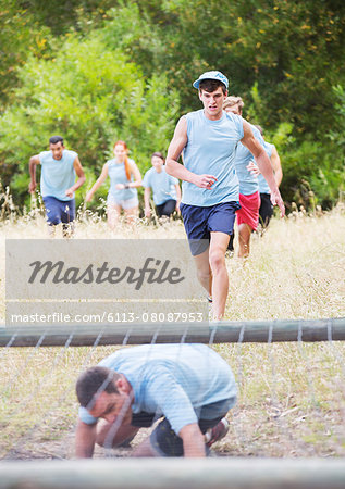 People running on boot camp obstacle course