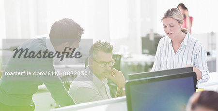 Business people working at computer in office Business people working at computer in office