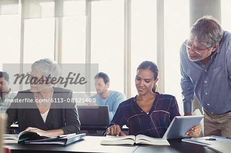 Students studying in adult education classroom