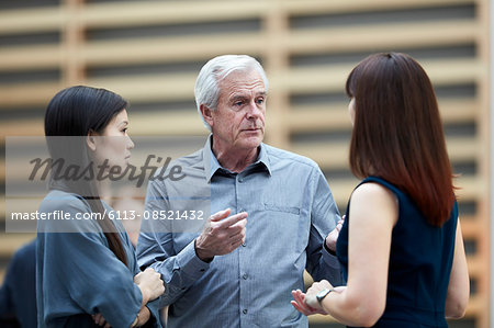 Business people talking in lobby