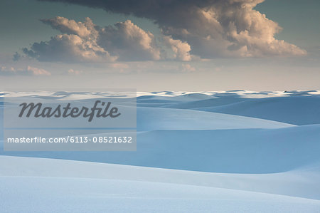 Clouds over tranquil white sand dunes, White Sands, New Mexico, United States