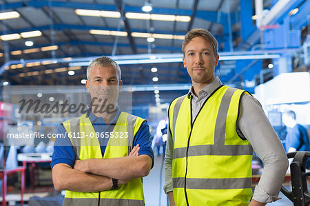 Portrait confident supervisors in steel factory