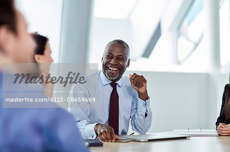Laughing businessman enjoying meeting