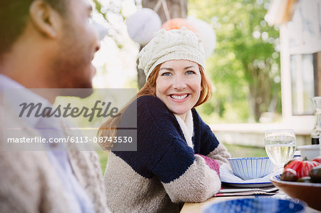 Portrait smiling woman at patio lunch table