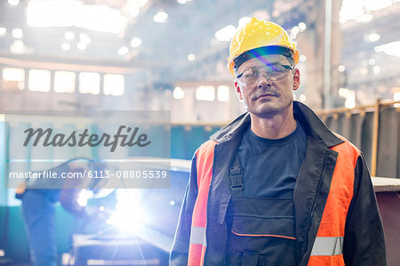 Portrait confident steel worker in factory Portrait confident steel worker in factory