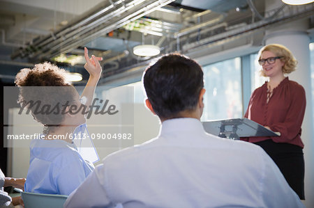 Businesswoman asking question in conference audience