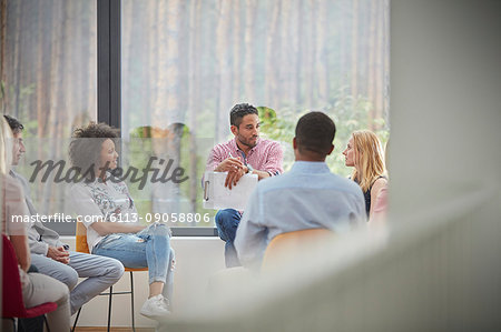 People talking in group therapy session