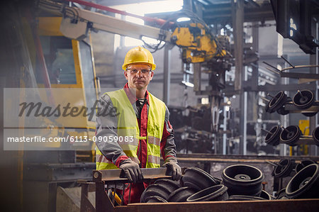 Portrait serious, confident steelworker in steel mill Portrait serious, confident steelworker in steel mill