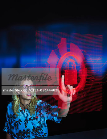 Businesswoman accessing security feature on futuristic hologram computer