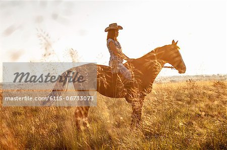 Croatia, Dalmatia, Young woman horseback riding