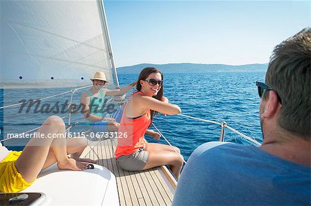 Croatia, Adriatic Sea, Young people on sailboat relaxing