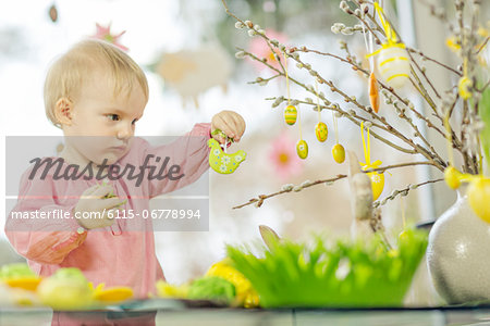 Young Girl Hanging Easter Decorations, Osijek, Croatia, Europe