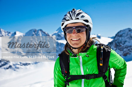 Female skier with ski goggles and skiing helmet, Stubai, Tyrol, Austria