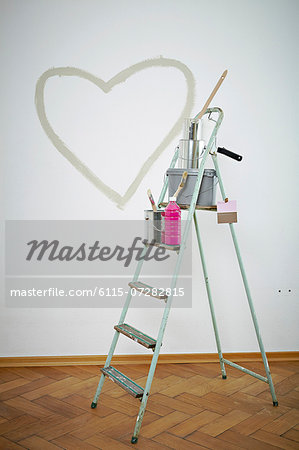 Painting equipment on a ladder, heart shape on wall, Munich, Bavaria, Germany