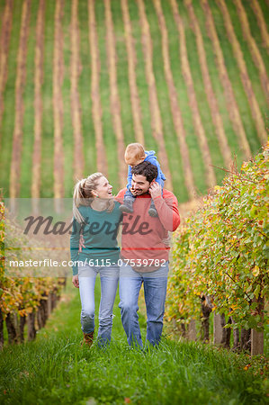 Family with one child walking in a vineyard, Osijek, Croatia