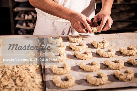 Confectioner making almond cookies