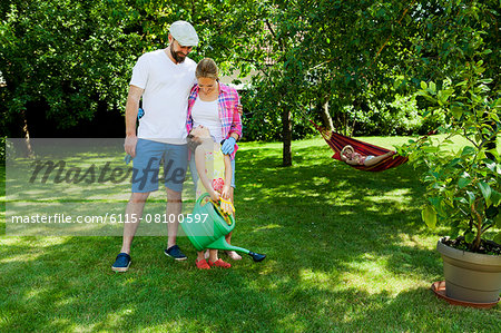 Family with two children in the garden, Munich, Bavaria, Germany