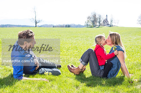 Family relaxing in garden