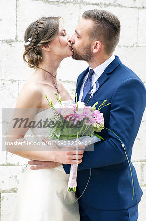 Bride and groom kissing