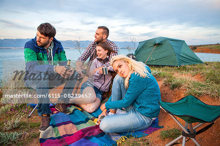 Group of friends at campsite celebrating