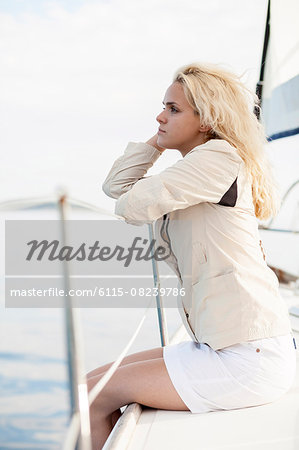 Young woman day dreaming on sailboat, Adriatic Sea