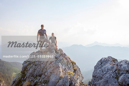 Young couple resting on mountain peak