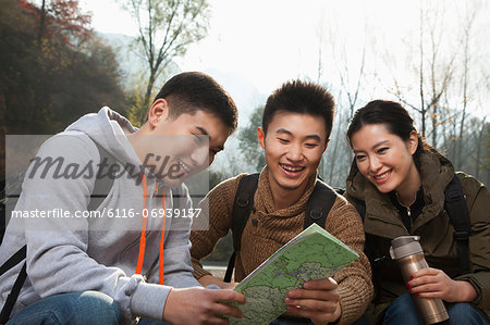 Friends sitting and looking at the map