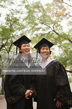 Professor and Graduate Walking On Campus