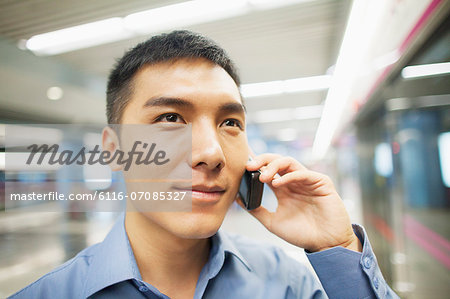 Young man talking on the phone, portrait