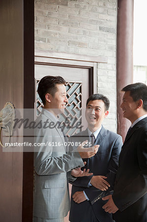 Businessmen in Doorway