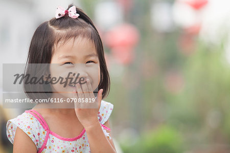 Portrait of Young Girl Laughing in Nanluoguxiang, Beijing, China