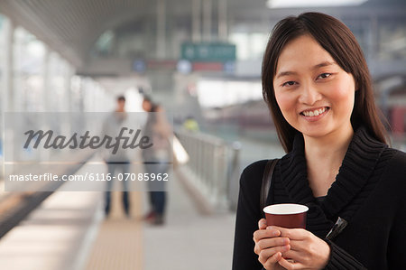 Young Woman on Train Platform