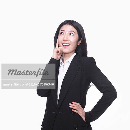 Businesswoman with hand on chin thinking