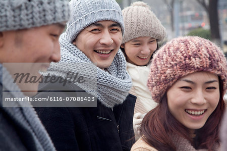 Group of Friends Playing Outdoors at Winter