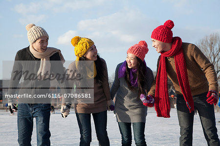 Friends on ice rink