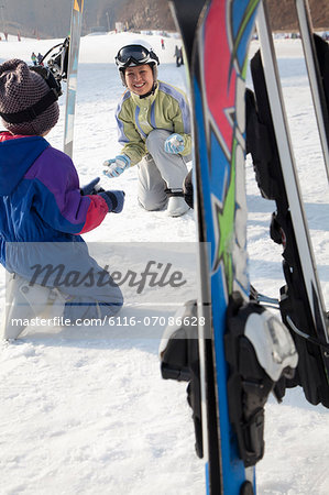 Smiling Family with Ski Gear in Ski Resort