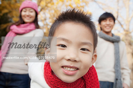 Young Family Enjoying a Park in Autumn