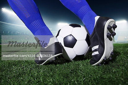 Premium Vector  Football logo. boot kicks the ball. vector illustration