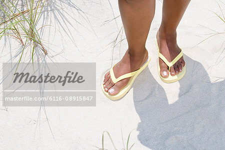 Woman wearing flip flops - Stock Photo - Masterfile - Premium Royalty-Free,  Code: 6116-08915847