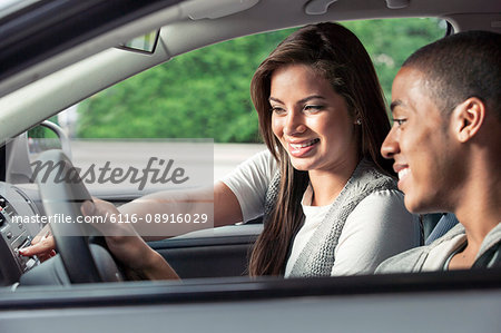 Teenagers driving car