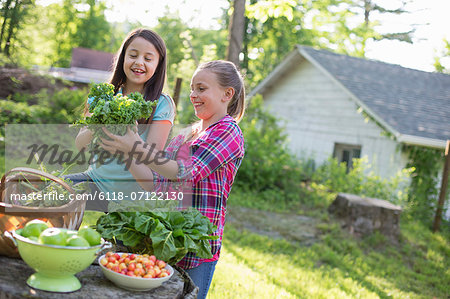 Organic Farm. Summer Party. Two Young Girls Preparing Salads.