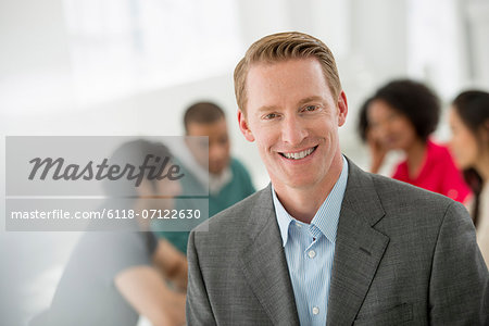 Business Meeting. A Man Smiling Confidently.